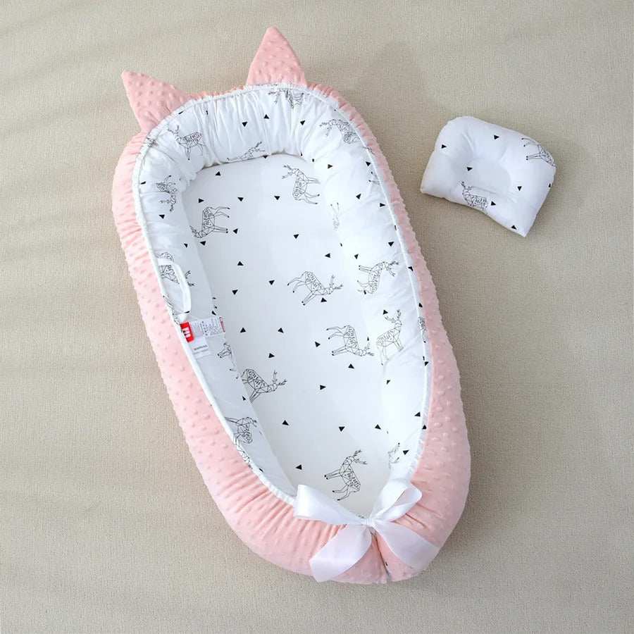 reducteur de lit bebe rose