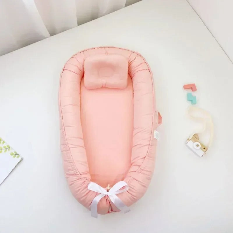 bébé réducteur de lit saumon