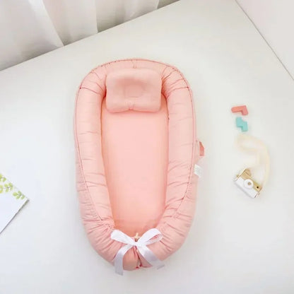 bébé réducteur de lit saumon