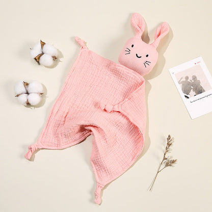 Doudou bébé en mousseline de coton doux avec visage brodé, idéal pour les petites mains.