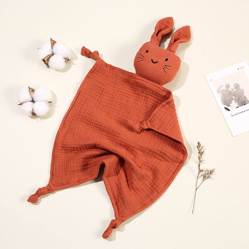 Doudou bébé en mousseline de coton doux, visage brodé, couleur moutarde, idéal pour petites mains.