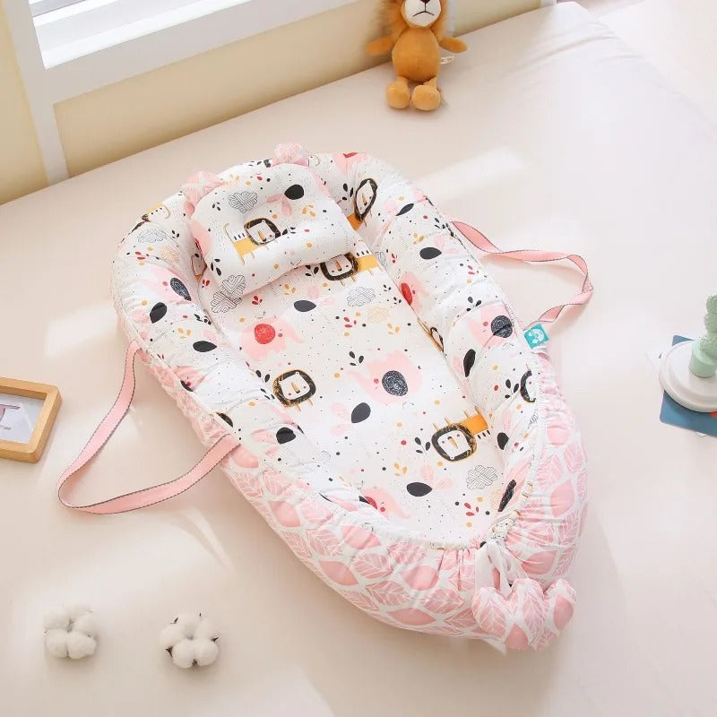 réducteur de lit bébé rose