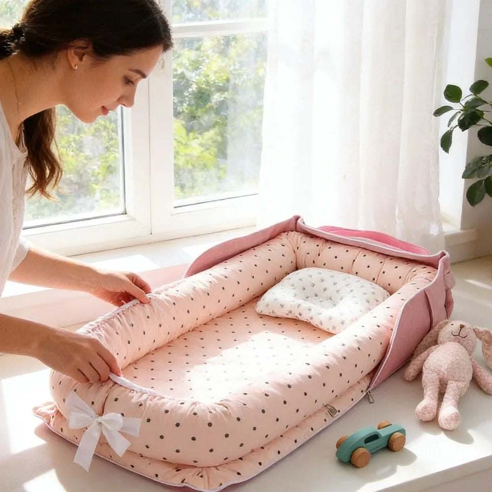 reducteur de lit pour bebe rose