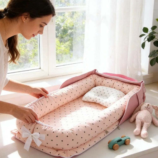 reducteur de lit pour bebe rose