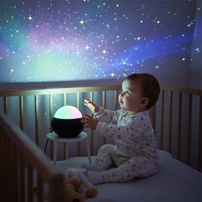 Veilleuse projection avec bébé assis a coter 